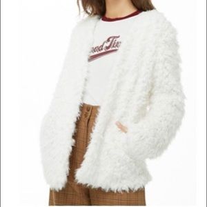 White faux fur coat